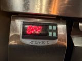 a digital clock on the side of an oven