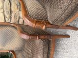 two chairs that are next to each other on the floor