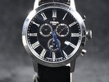 une image représentant une montre noire dont le cadran est orné de chiffres romains