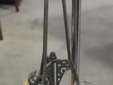 three lamps that are on a stand in a room