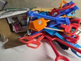 a pile of assorted plastic tools on a table