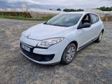 a picture of a small white car parked in a lot