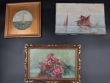 three paintings hanging on the wall above a vase of flowers