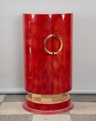 an image of a red cabinet sitting on top of a checkered floor