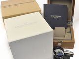 an image of a box with a watch inside of it on a white surface
