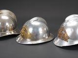 three helmets that are sitting next to each other on a table