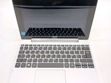 a laptop computer sitting on top of a white table