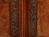 a close up of a door handle on a wooden door