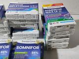 several boxes of toothpaste are stacked on top of each other
