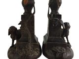 pair of antique bronze bookends depicting a man and a woman with a dog