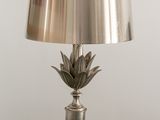 a close up of a lamp on top of a marble table
