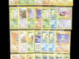 a lot of pokemon cards that are on the table