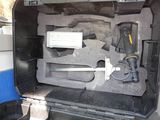 a tool in the back of a truck that is open