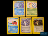 four pokemon cards are shown on a black background