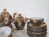 many plates and cups that are sitting on a table