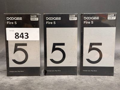 three black and white numbered numbers are displayed on a table