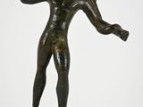 an image of a bronze statue of a boy holding a ball