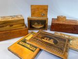 five wooden boxes that are sitting on a table