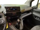 a dashboard of a car with a radio and steering control