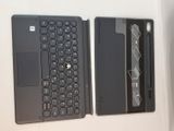 two laptops sitting side by side on a table