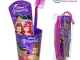 disney princess toothbrushes in a plastic cup with a pink handle