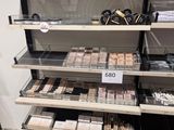 a lot of makeup products on the shelves in the store