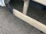 a close up view of a truck with a flat tire