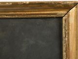 painting of a blackboard in a gold frame on a white wall