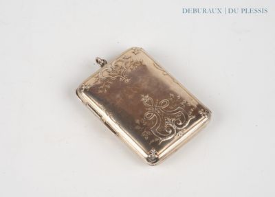a small silver box on a white surface