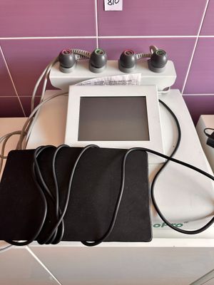purple tiled bathroom with a white sink and a black bag