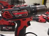 two electric tools that are sitting on a table