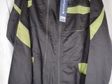 the jacket is black and green and has a blue tag on it
