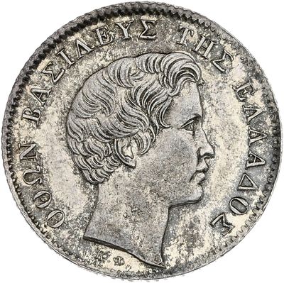 une pièce de monnaie en argent portant un visage de femme