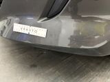 the rear bumper of a car with a sticker on it ' s bumper
