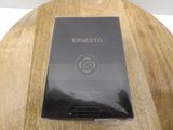 a book on a wooden table with a black cover