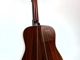 an image of a guitar on a stand against a white background