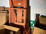 many cardboard boxes that are stacked on top of each other
