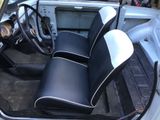 a small car with two seats and a steering wheel