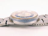 a close up of a wrist watch on a white surface