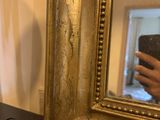 a person taking a picture of themselves in a mirror