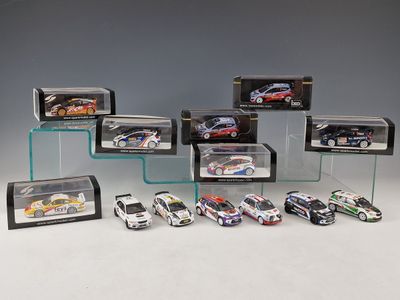 a lot of different model cars in a display case