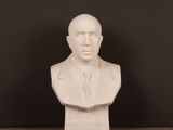 a close up of a bust of a man on a table