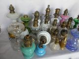 a lot of glass and brass items on a table