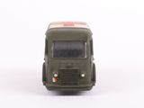 a green toy truck with a red cross on the front