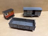 two toy trains sitting next to each other on a table