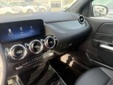 the interior of a car with a touch panel and steering controls