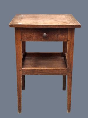 an old wooden table with a drawer underneath it on a gray background