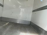 an image of an empty room with a air conditioner on the wall