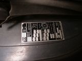 a close up of a car ' s engine with a sticker on it