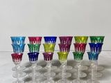six wine glasses are lined up in a row on a table